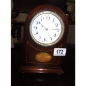 A small French enamel faced clock with key (enamel slightly a/f)
