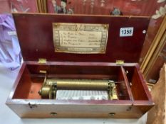A Victorian cylinder music box playing 4 airs /tunes. Made in Geneva - all teeth and tips present.