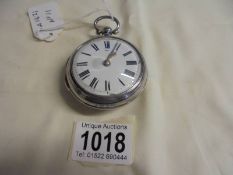 A silver pair-cased Verge, Springall, Norwich, No.21571 key wind pocket watch. cracked dial, not