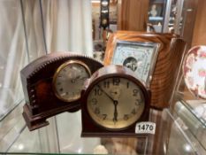 Two clocks and a barometer