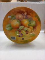 A fine Caverswall hand painted fruit study by Keith Hancock on shallow bowl