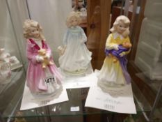 A set of 3 Royal Doulton NSPCC figurines Faith, Hope and Charity with certificates