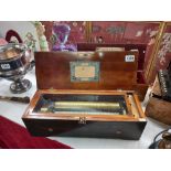 A Victorian cyclinder music box playing 6 airs /tunes- all teeth and tips present. Made in Geneva.