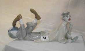 A Lladro clown laying down