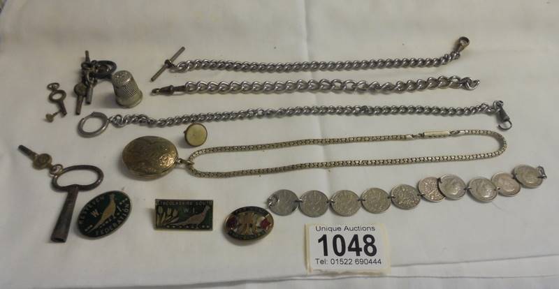 A quantity of watch chains, watch keys, badges etc.,