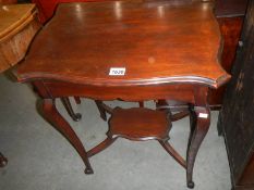 An Edwardian mahogany side table. COLLECT ONLY.