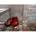 A quantity of crystal glass ornaments including Swarovski, a banjo plus a small violin in case