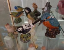 A quantity of bird figurines including Mack etc