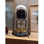 A glass-domed anniversary clock - Collect only