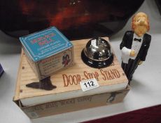 A novelty butler door stop and service bell, both with boxes