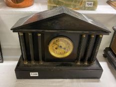 A large black Palladian style mantel clock a/f