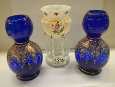 A mid 20th century opaque glass lustre and a pair of blue glass vases.