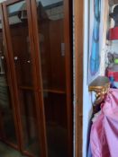 A tall glazed two door display cabinet/bookcase, COLLECT ONLY