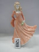 A Royal Worcester figurine - Floral Ladies October.