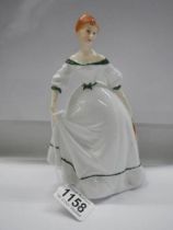 A Royal Doulton figurine - Coming of Age.