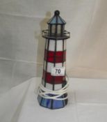 A leaded coloured glass lighthouse table lamp