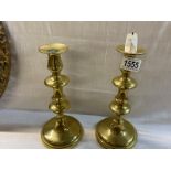 A pair of good quality brass candlesticks.