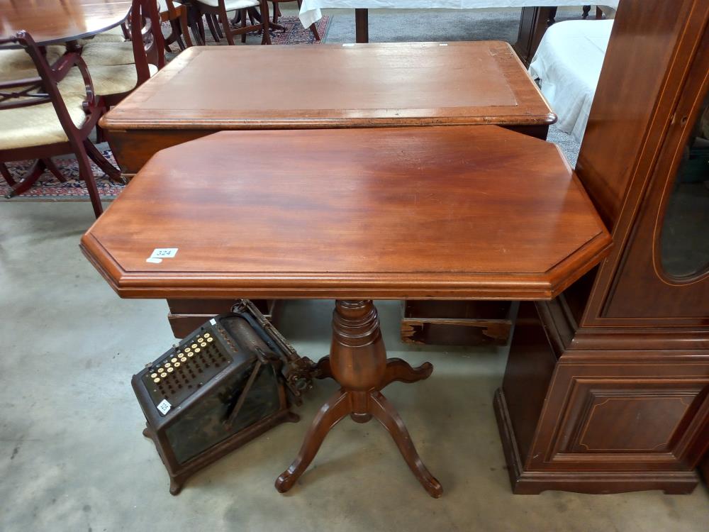 An octagonal mahogany tea table on turned centre column, COLLECT ONLY.