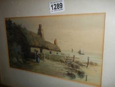 A framed and glazed coastal scene watercolour, signed. COLLECT ONLY.
