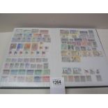 A stamp album with several complete pages of world stamps.