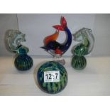 Two Mdina style seahorse paperweights and two others.