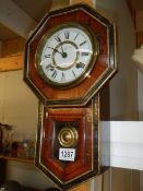 An early 20th century drop dial wall clock in working order. COLLECT ONLY.