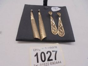 A pair of long drop and a pair of filigreee gold earrings, (no backs) 3.2 grams.