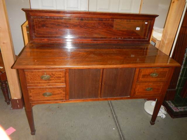 An early Victorian mahogany sideboard with four drawers and shutter centre. COLLECT ONLY.