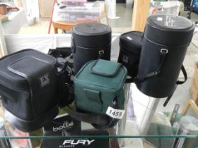 A quantity of camera lens cases (no lenses).