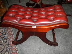 A good quality deep buttoned sabre leg stool in red, COLLECT ONLY.