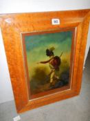 A reverse painting on glass of a soldier in a birds eye maple frame. COLLECT ONLY