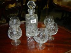 A cut glass decanter and six cut glass brandy glasses, COLLECT ONLY.
