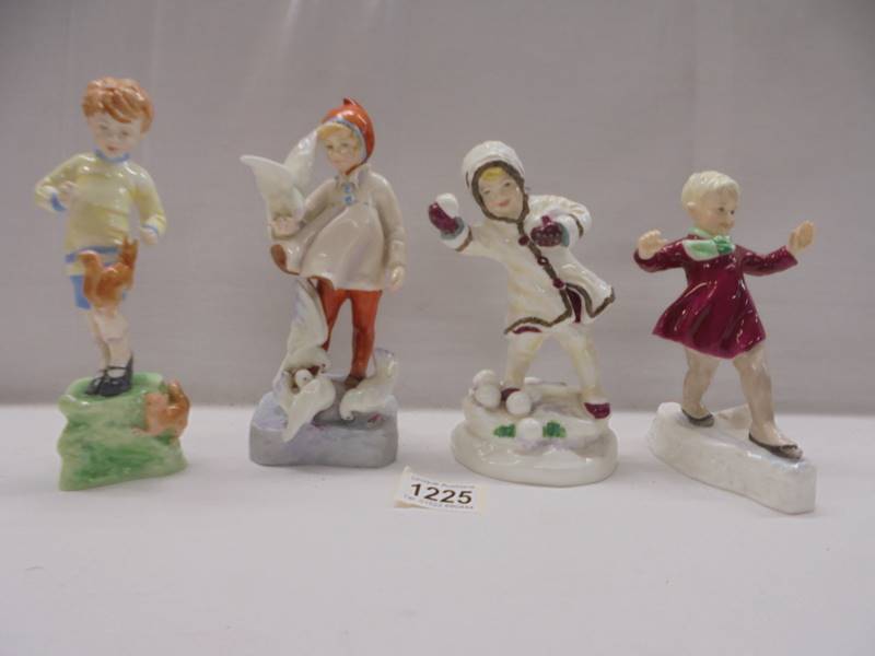 Four Royal Worcester Months of the Year figurines - October, November, December, January.