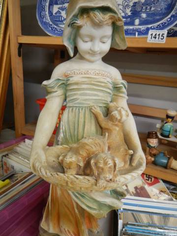 A tall early 20th century plaster figure of a girl with puppies. COLLECT ONLY. - Image 2 of 2