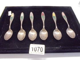 A set of 6 1976 silver and enamel year of the rose teaspoons.