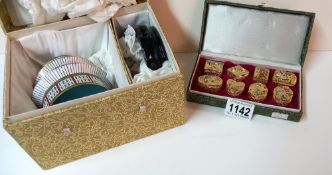 A boxed set of gilded cloisonne pill boxes & a boxed Chinese Pagoda