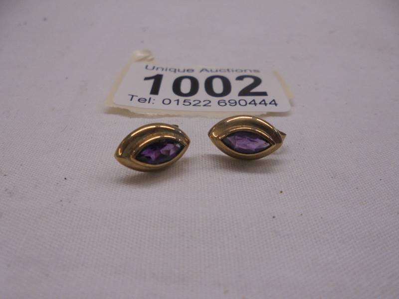 A pair of 9ct gold amethyst set earrings, 2.79 grams in total.