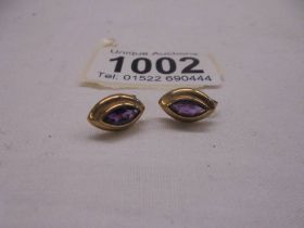 A pair of 9ct gold amethyst set earrings, 2.79 grams in total.