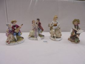 Four continental porcelain figures each stamped with a crown over M R.