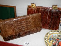 Two vintage snakeskin hand bags.