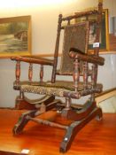 An early 20th century child's rocking chair, COLLECT ONLY.