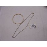 A 9ct gold bangle and a 9ct gold neck chain, 16.69 grams.