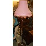 An oak standard lamp with pink shade, COLLECT ONLY.