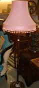 An oak standard lamp with pink shade, COLLECT ONLY.
