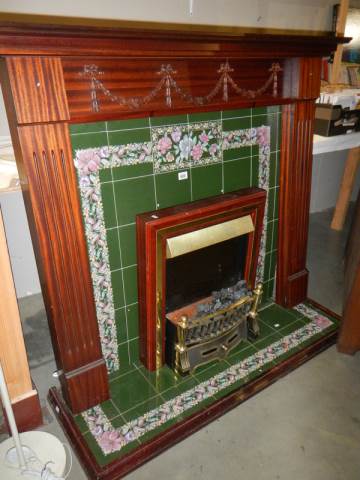 A good quality fire surround with tiled inset and fire. COLLECT ONLY.