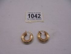 A pair of 9ct gold hoop earrings, 2.9 grams.