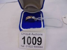 A white stone set 9ct gold band ring, hall marked Birmingham (1994), Size G half, 2.7 grams.