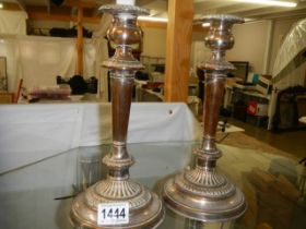 A pair of Victorian Sheffield plate candlesticks.