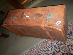 An old leather suitcase with straps. COLLECT ONLY.