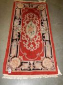 An old wool rug, 132 x 63 cm, COLLECT ONLY.